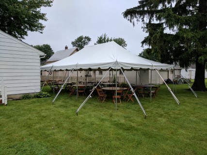 20' x 30' Pole Tent, Wood Chairs, 60" Round Tables.