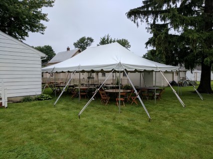 20' x 30' Pole Tent, Wood Chairs, 48" Round Tables.