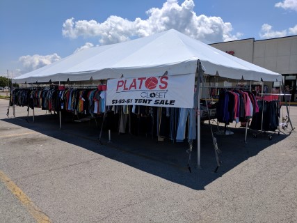 Parking Lot Sale - 20' x 40' Frame Tent, Free Span. Coat Racks and Custom Racking for Clothing.