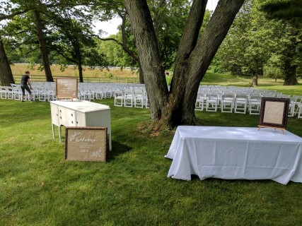 Outdoor Wedding Ceremony - Formal White Padded Chairs.