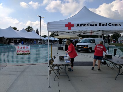 Red Cross Fundraiser at the Marathon Center for the Performing Arts - 10' x 10' Pop-up Tents, 40' x 100' Tent, 20' x 40' Tent, Rectangular Tables, Steel Chairs, Stage, Tent Lights.
