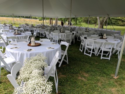 Wedding Reception at Scarlet Oaks Estate - 40' x 60' Tent, White Padded Chairs, Round Tables, Linens, Centerpieces, Flowers.