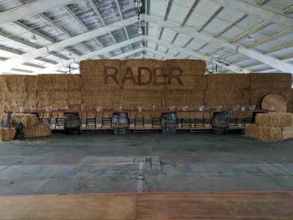 Rustic Pavilion Wedding Reception - Round and Rectangular Tables, Wooden Chairs, Hay Bales, Barrels.