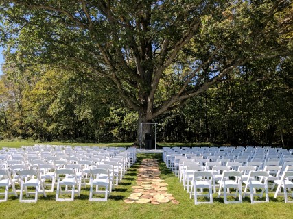 White Padded Chairs, PA System with Podium.